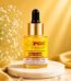 PGC Prism Glow Cosmetics Powerful Brightening Face Serum bottle with Vitamin C and Alpha Arbutin on a marble pedestal