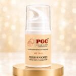 PGC Prism Glow Cosmetics SPF 70 Tinted Sunscreen Cream with Foundation airless pump bottle on gold pedestal